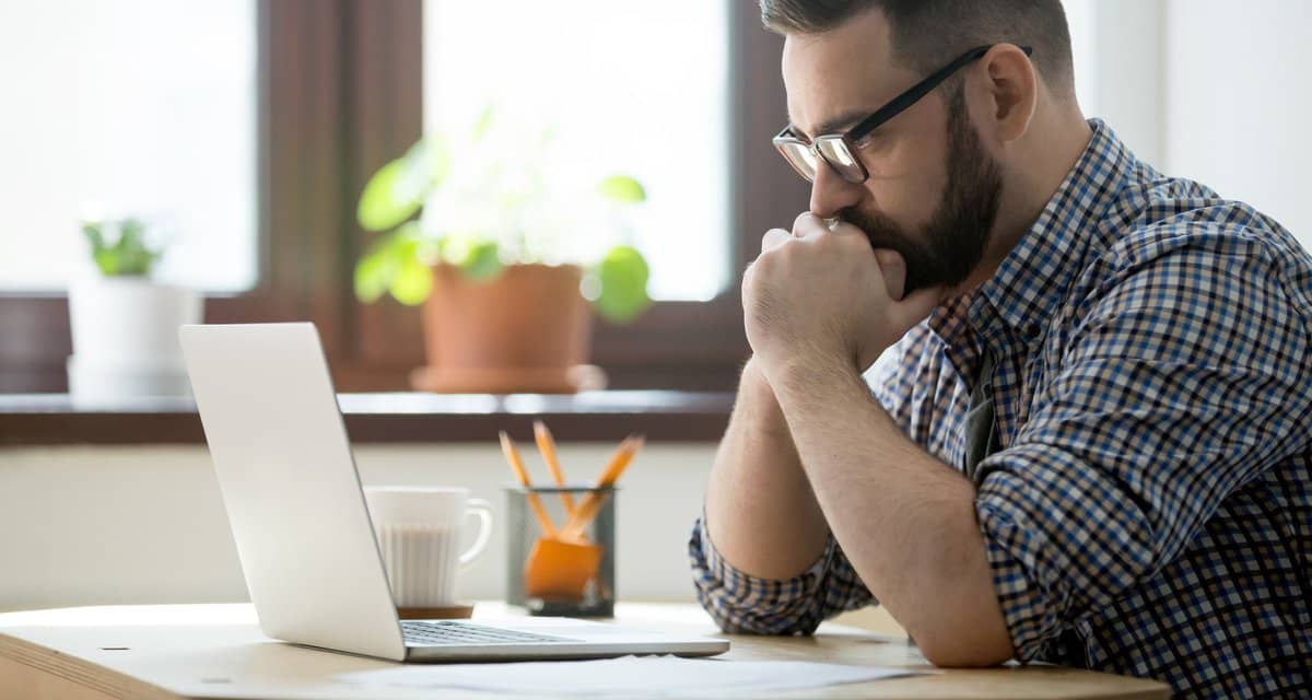 Stressed man with laptop pboAzQu.width