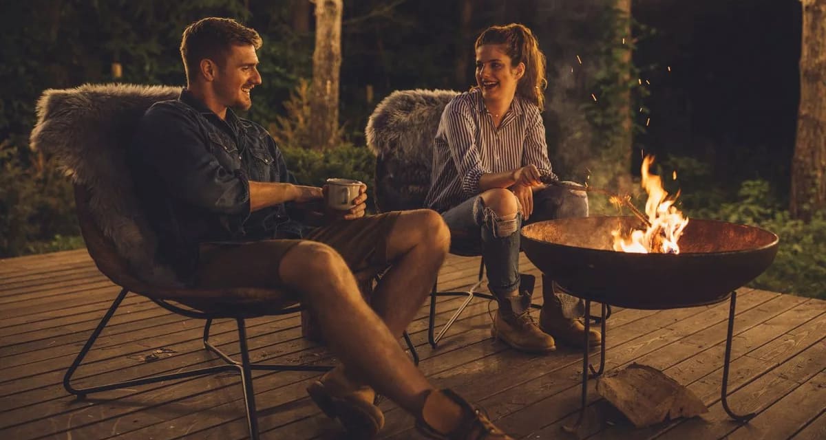 Young couple relaxing by a campfire PXmvo.width .jpg