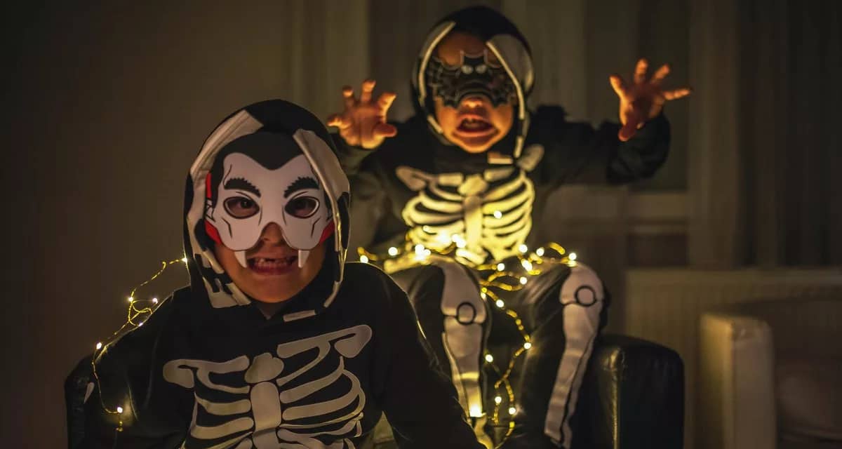 two young boys in Halloween costumes making s.width whBeGo.jpg