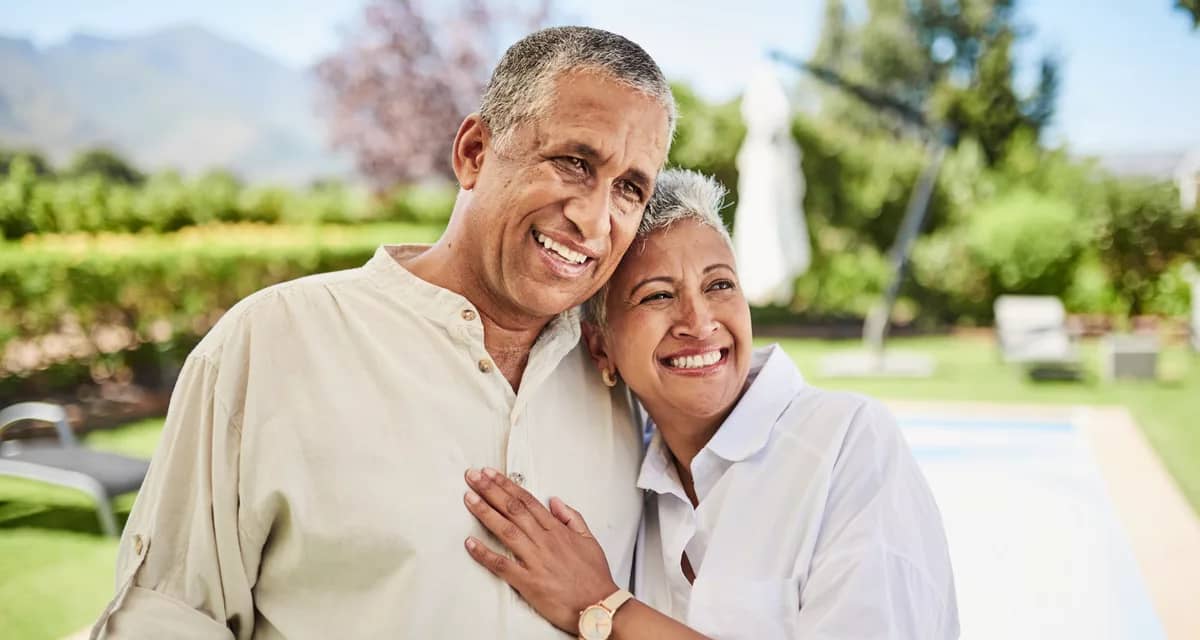 gettyimages older couple man and woman smiling pool millionaire wealthy.jpeg