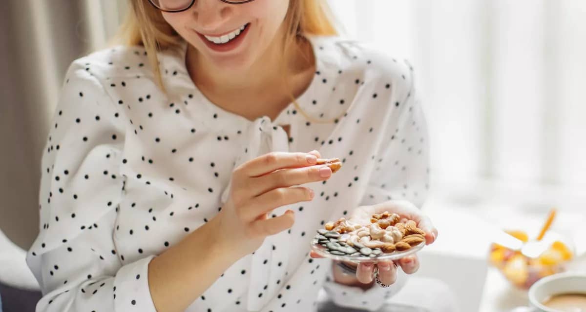 Person munching on some snacks they hold in t.width .jpg