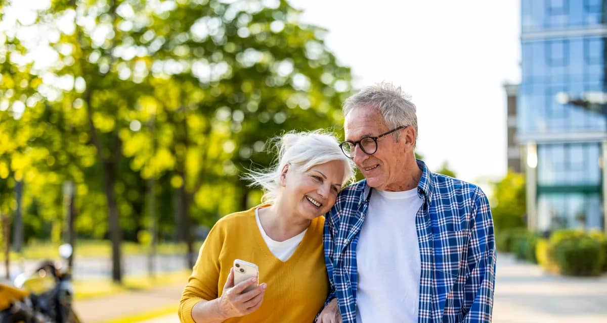 smiling couple walking down street together.jpg
