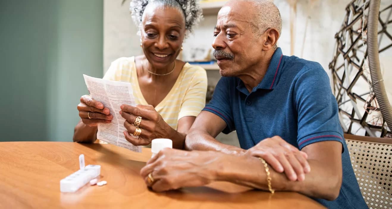 couple sitting at table looking at document.jpg