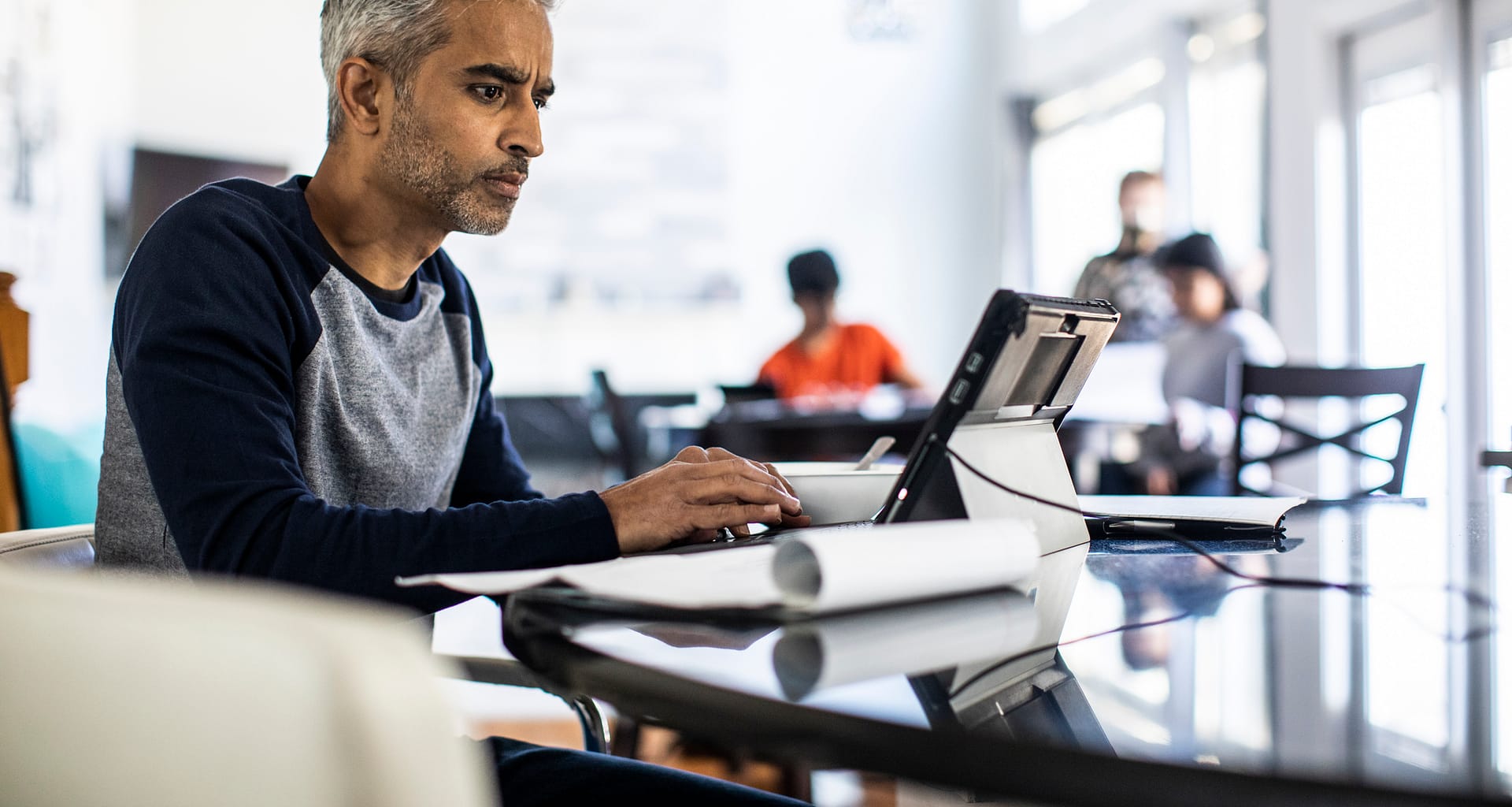 person looking intently at laptop screen RtKWA