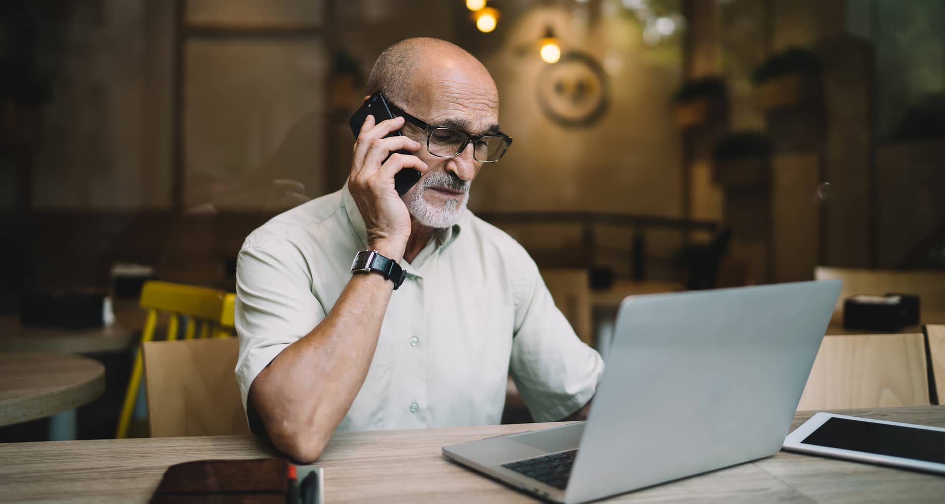 older man laptop phone upset gettyimages DKKnZ