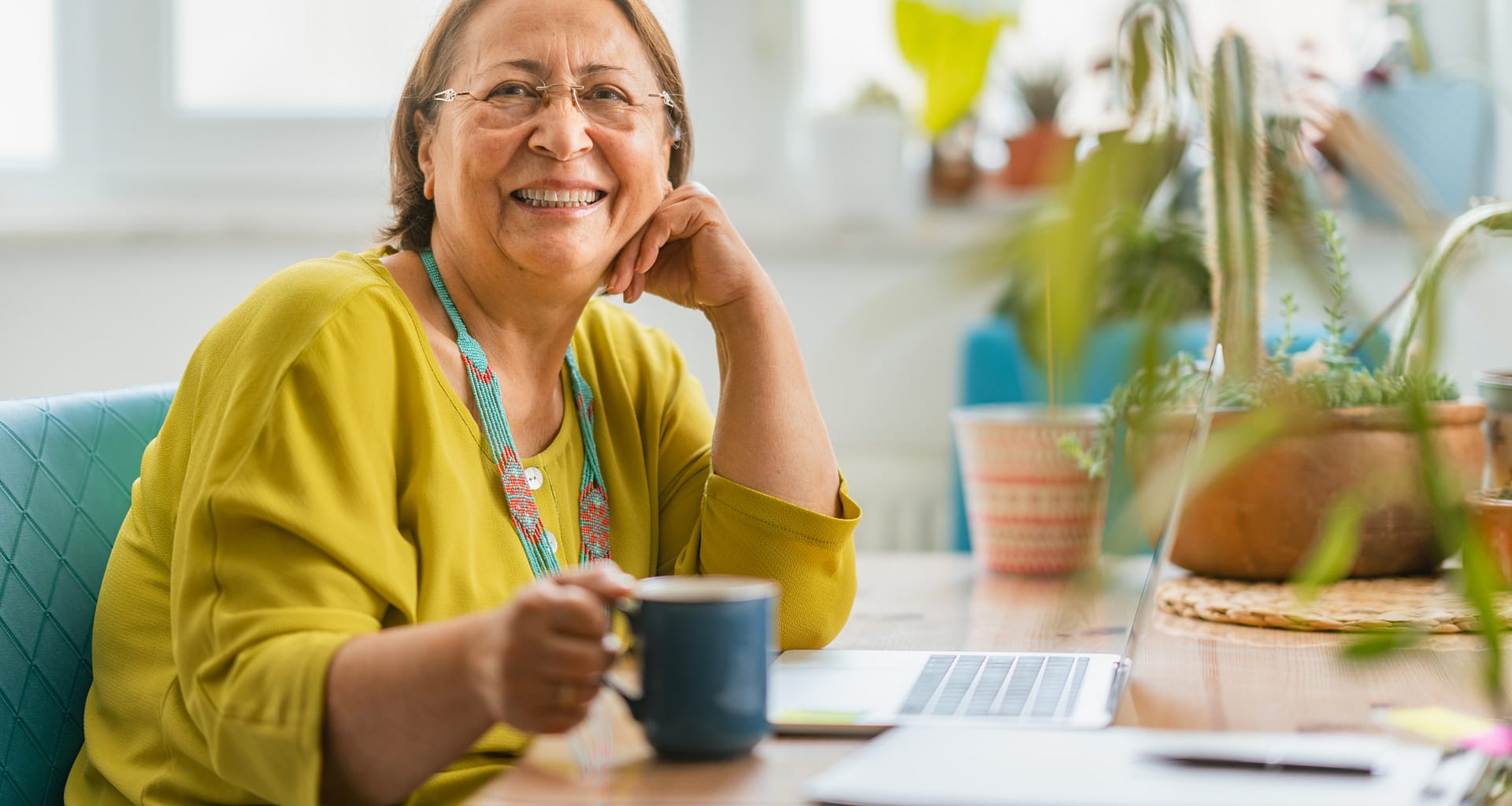 person sitting at a desk and smiling CMokn
