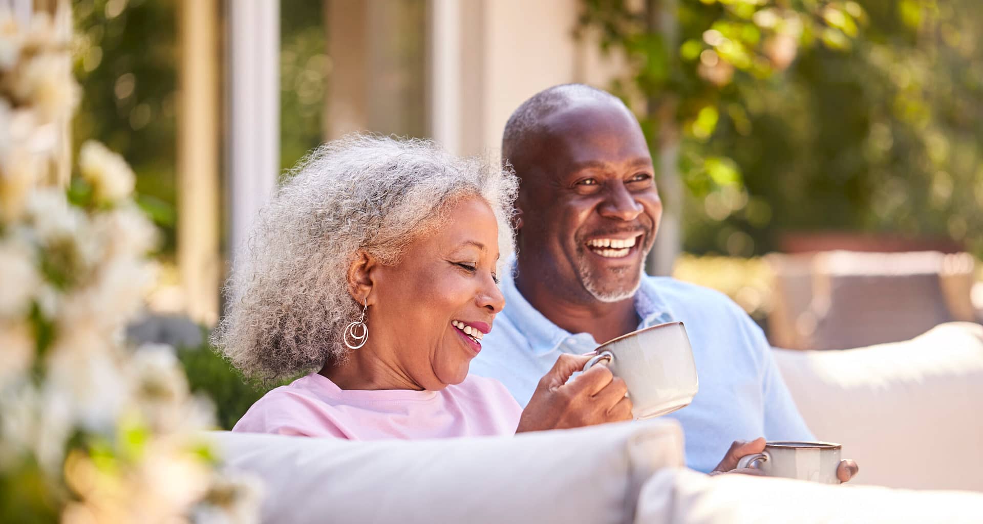 retired couple on patio happy YvIV