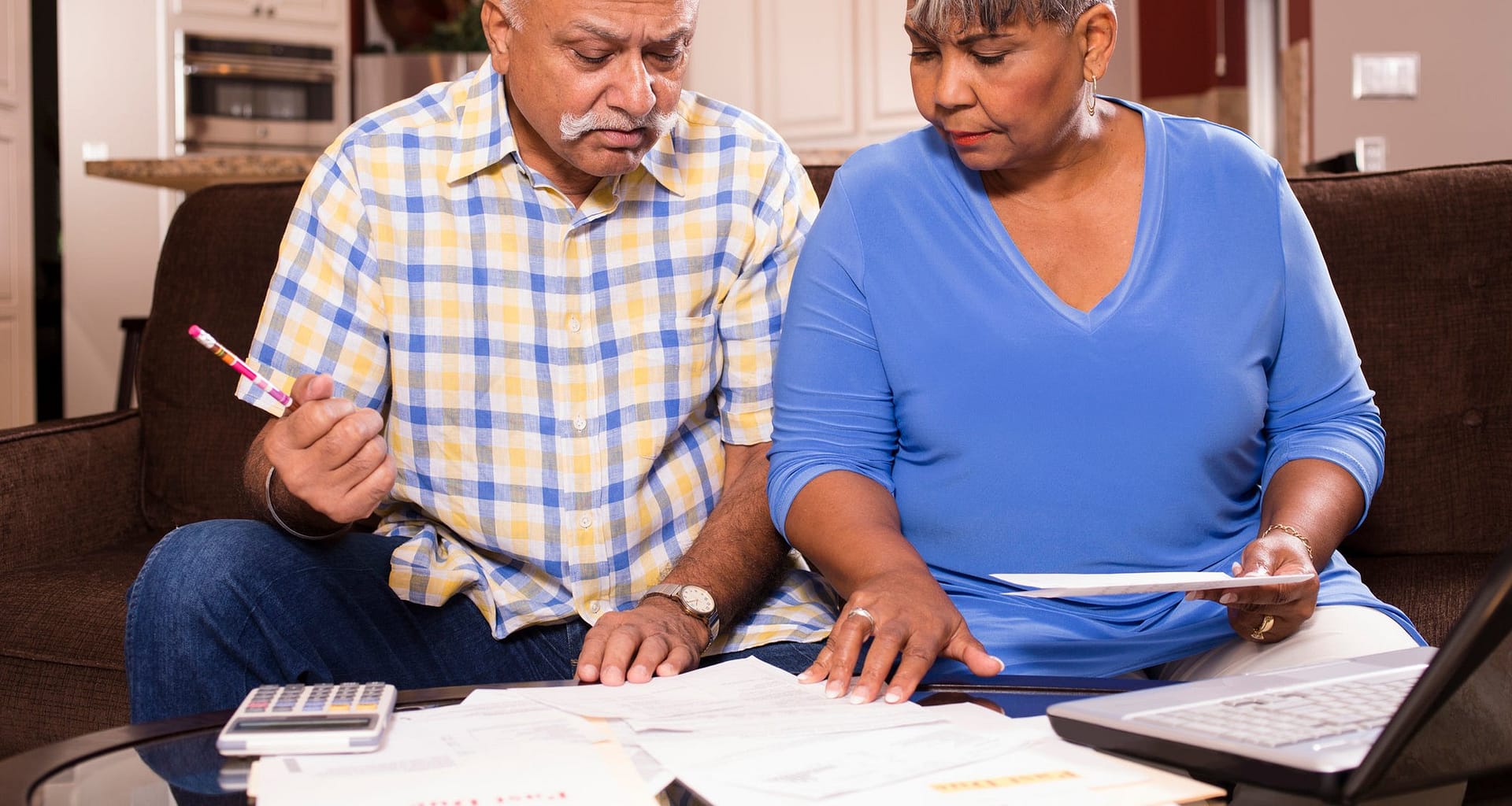 two people looking at documents bNJjmb