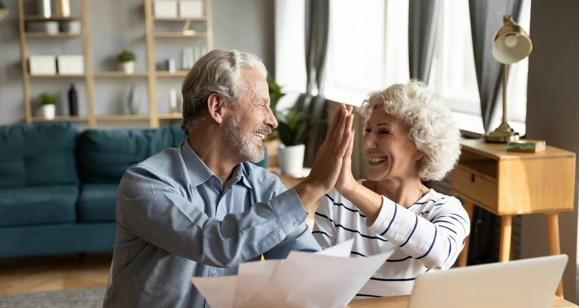retired couple reviewing finances on a laptop.jpg