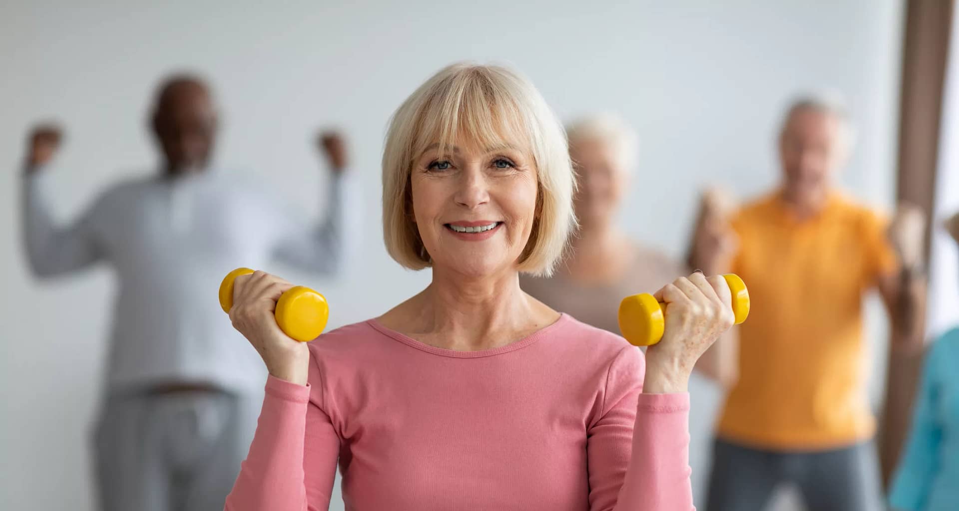 getty smiling with weights exercise fitness workout.jpg