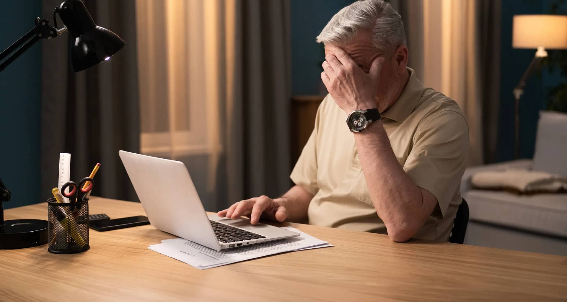 older man laptop covering face gettyimages .jpg