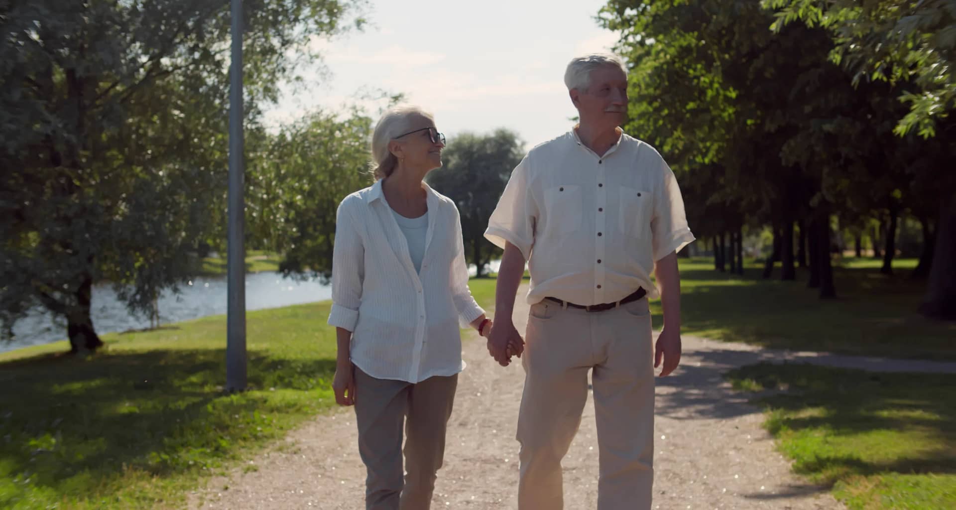 senior couple holding hands outside gettyimages .jpg
