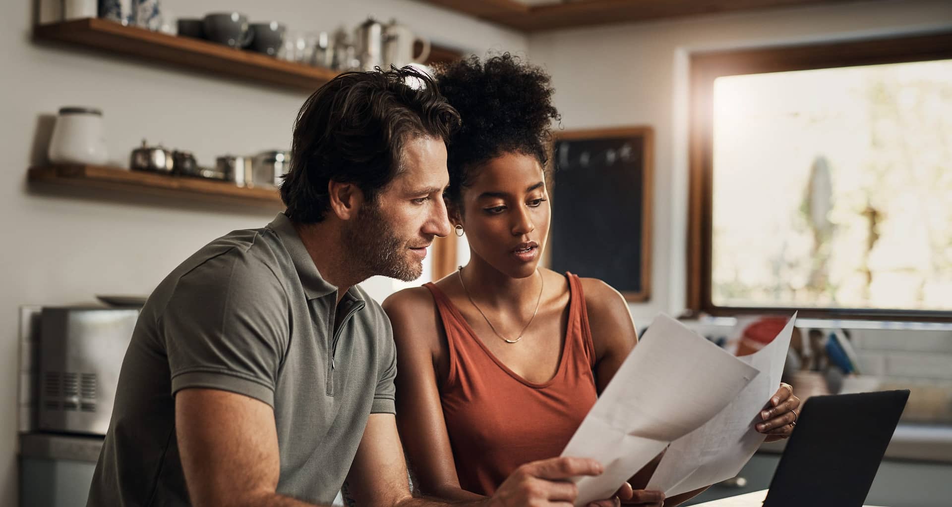 couple looking at financial papers.jpg
