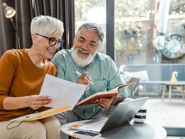 excited couple looking at document together.jpg