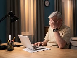 older man laptop covering face gettyimages .jpg