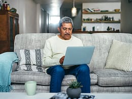 senior man laptop couch gettyimages .jpg