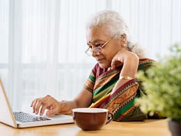 serious senior staring at laptop.jpg