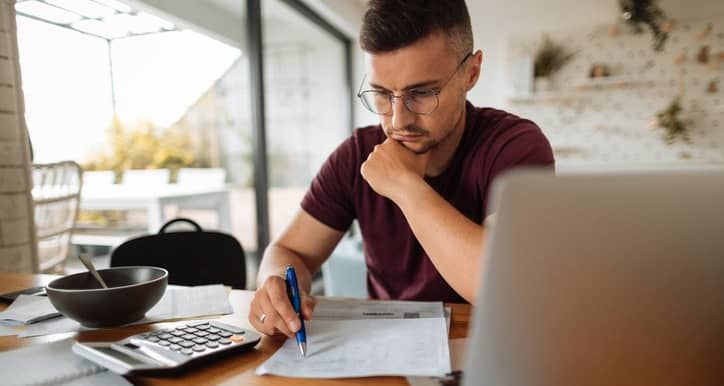 stressed man with bills and laptop.width .jpg