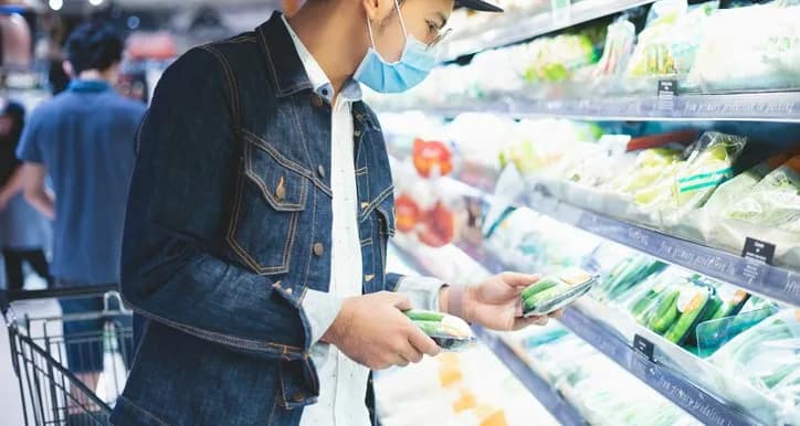 man in mask grocery shopping.width .jpg