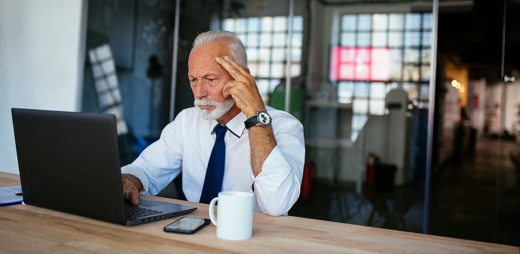 older man laptop serious gettyimages