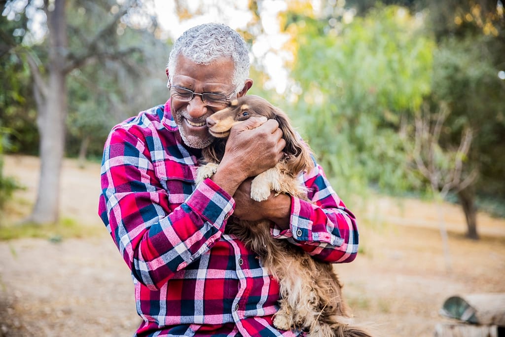 retired senior with his dog