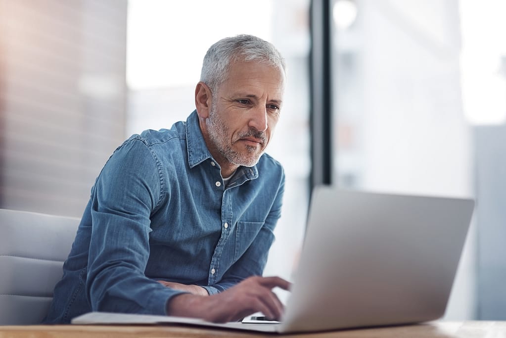 older man at laptop gettyimages