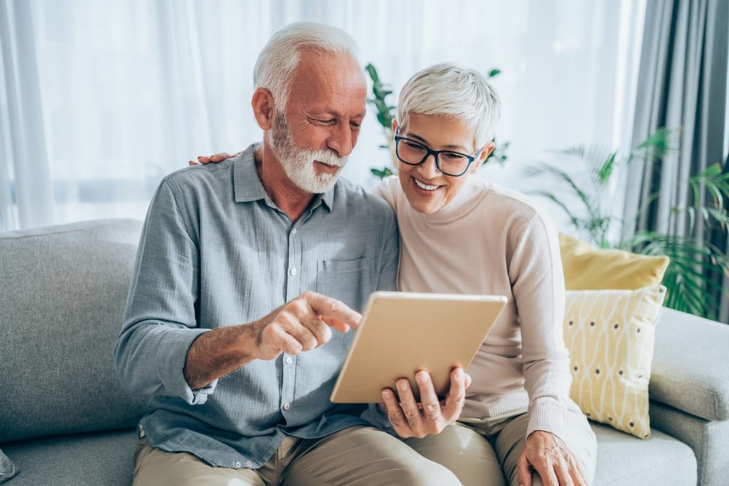 senior couple looking at tablet gettyimages