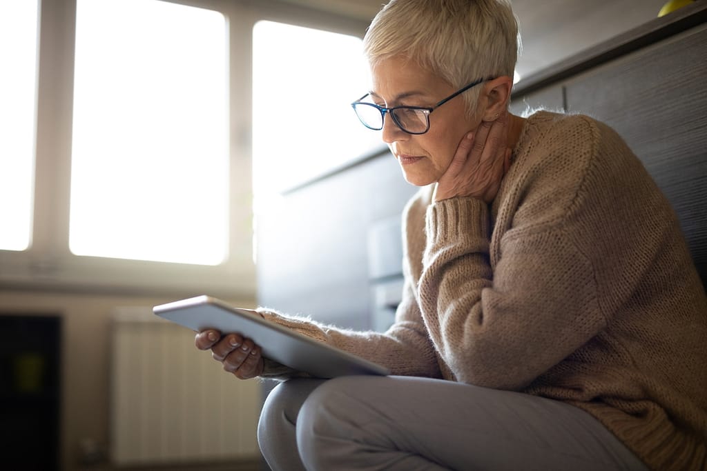 senior woman holding tablet gettyimages