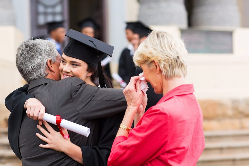 Female college grad hugging dad XOFFTxD.width .jpg