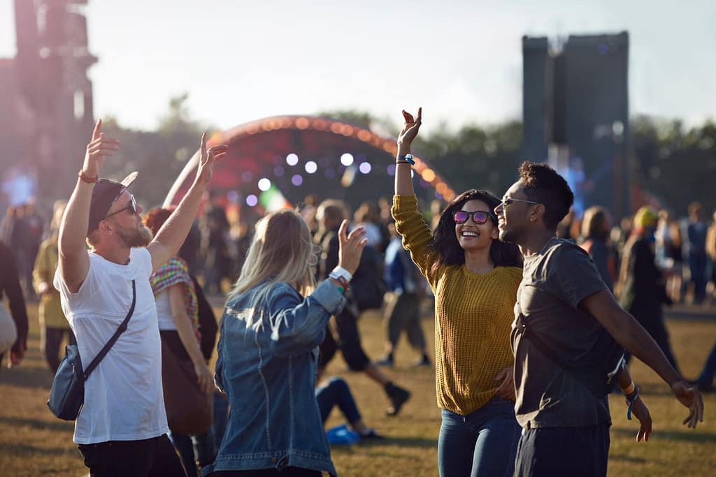 friends dancing at music festival sNvM.width .jpg