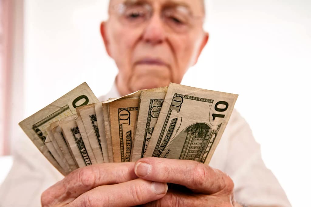senior fanning cash retirement social security getty.jpg