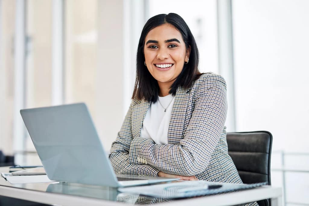 woman s a smiling person at a laptop gettyimages .jpg