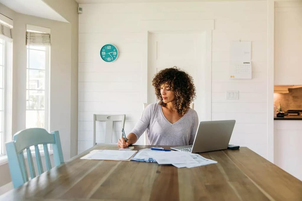 woman with laptop and notes at home RFqPxm.width .jpg