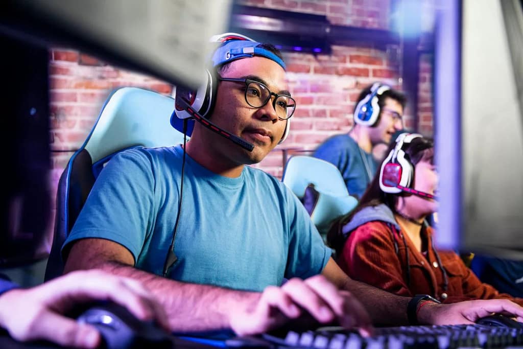 Adults engaging in computer gaming in a room .width yOPuzwK.jpg