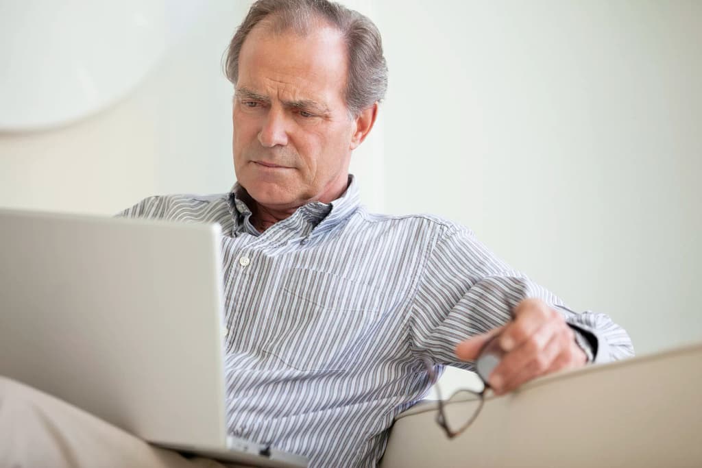 serious senior using laptop social security getty.jpg