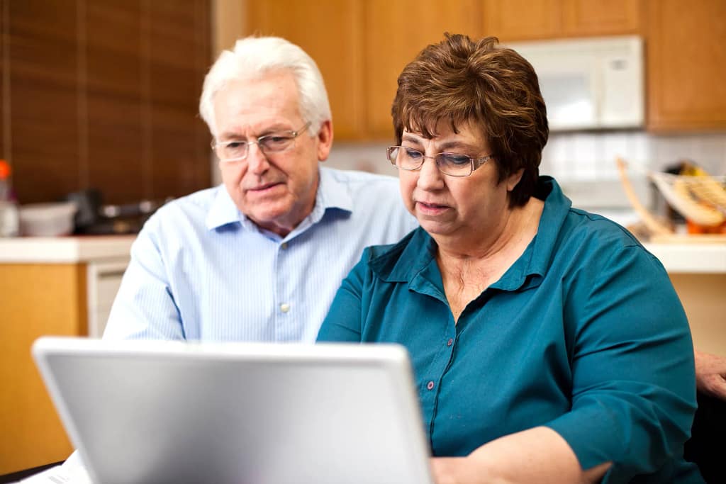 senior couple serious at laptop gettyimages .jpg