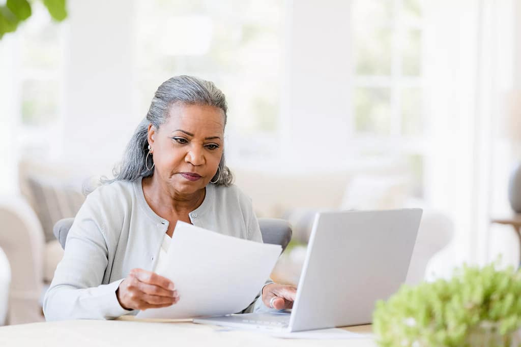 older woman document laptop.jpg