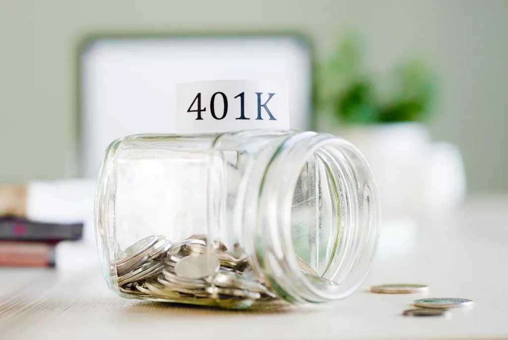 getty images k savings jar tipped over half empty.jpg