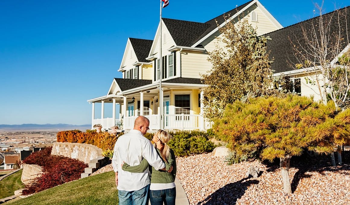 Couple standing outside admiring a large impr.width uPzLDk.jpg