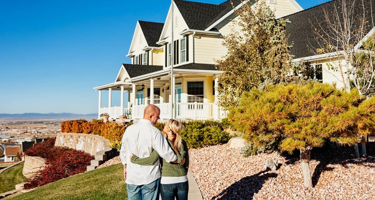Couple standing outside admiring a large impr.width uPzLDk.jpg
