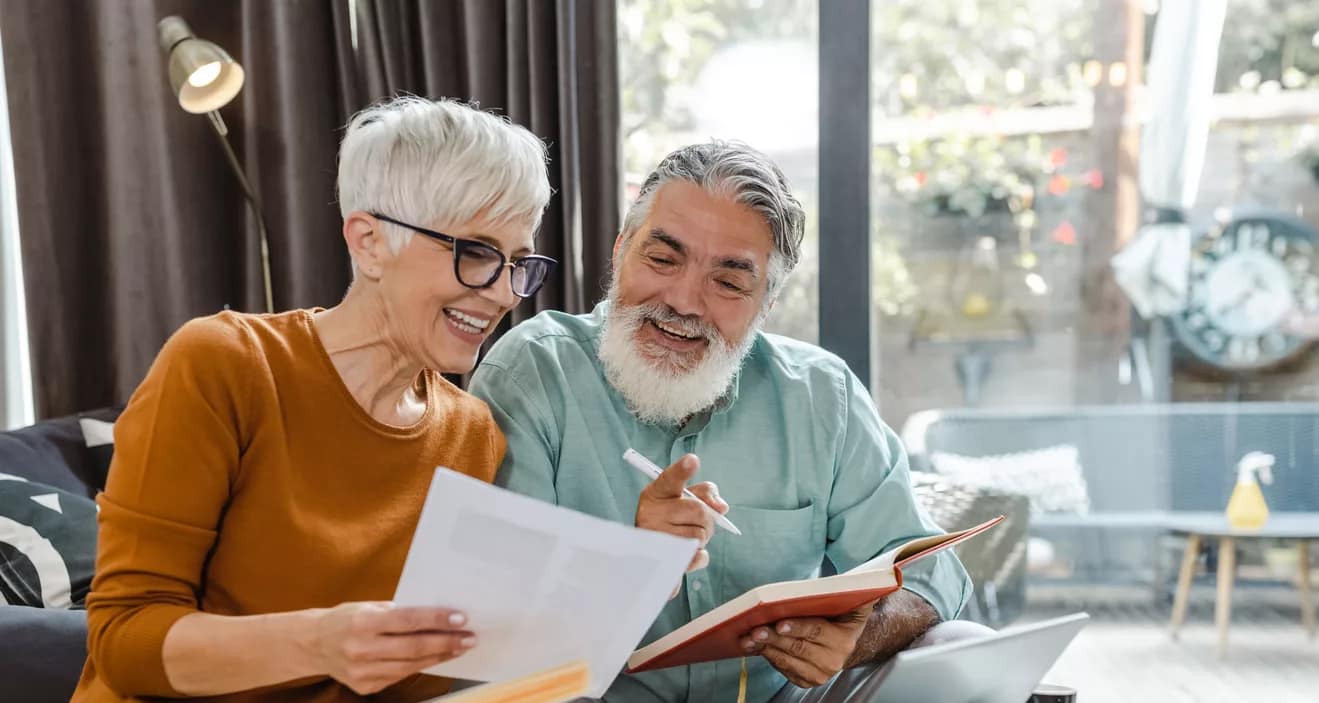 excited couple looking at document together.jpg