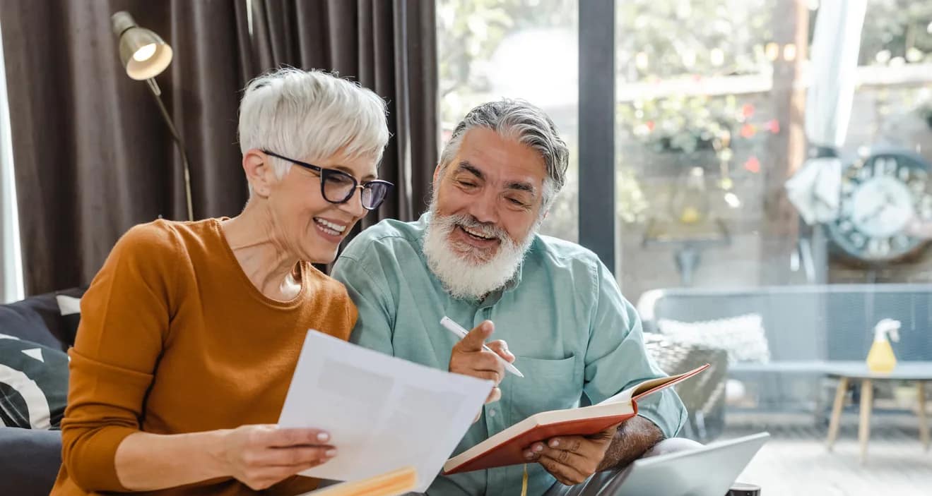 excited couple looking at document together.jpg