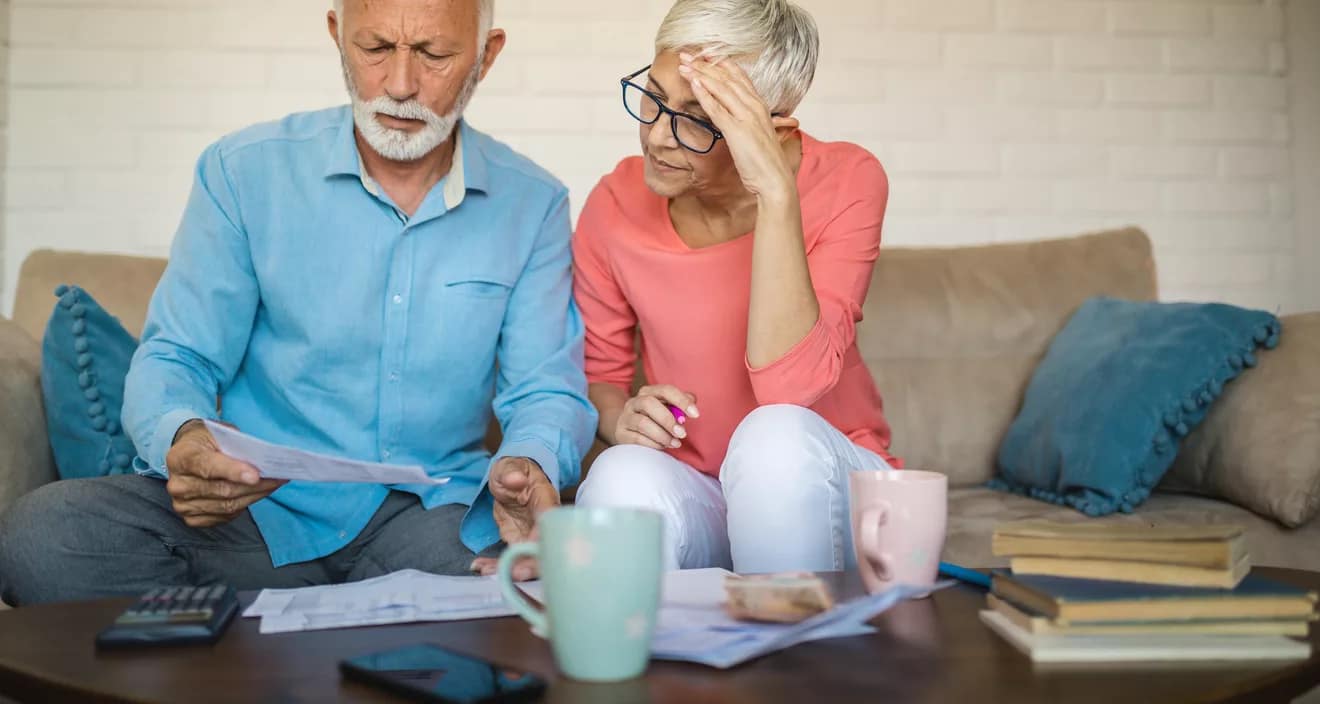 stressed couple looking at documents.jpg