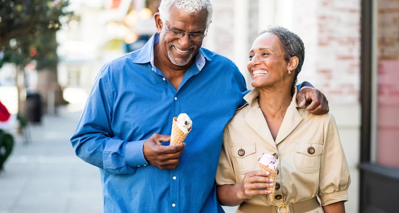 smiling couple eating ice cream cones.jpg