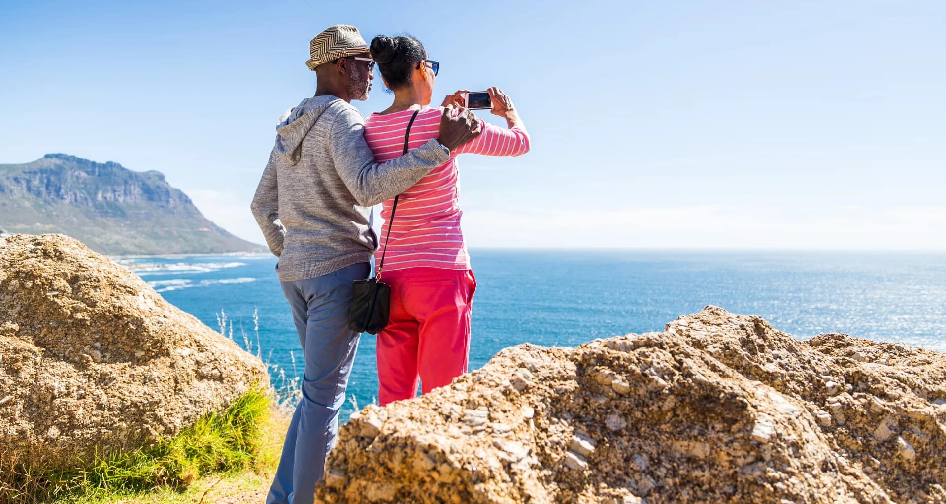 senior couple taking photo of the ocean.jpg
