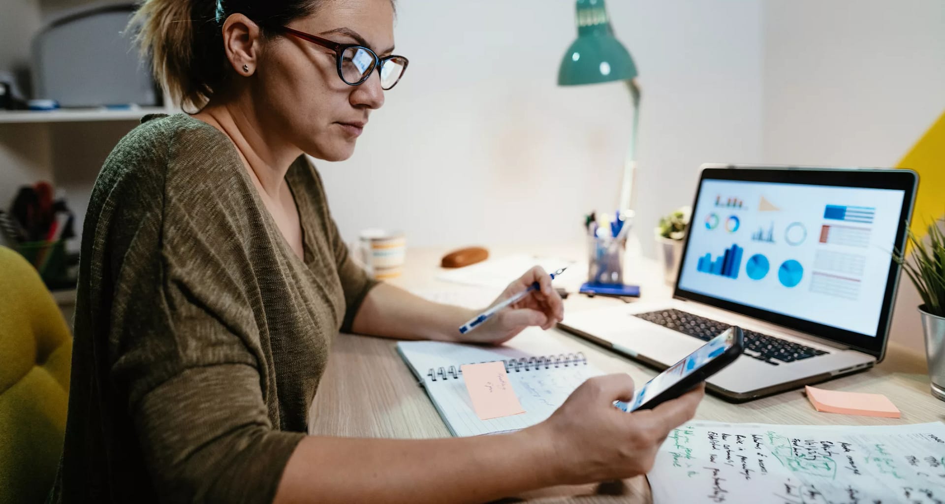 female investor reviewing her portfolio on a laptop.jpg