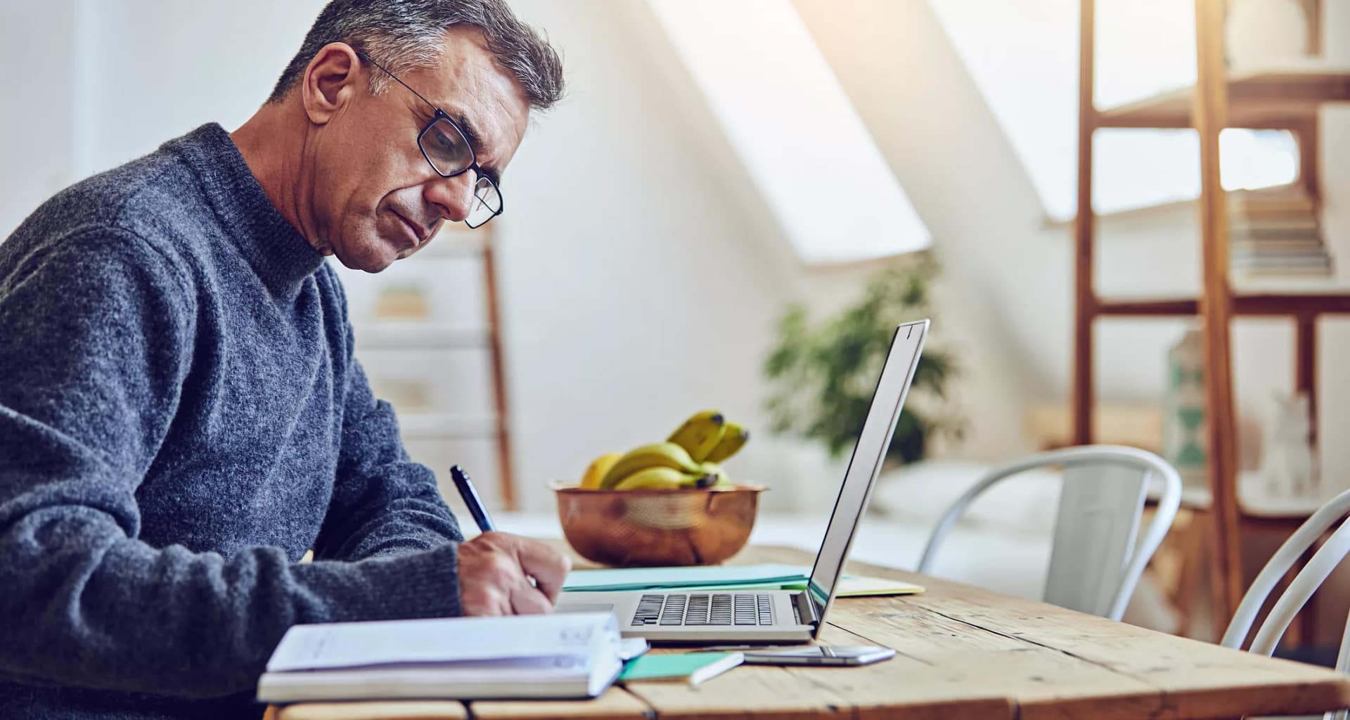 older man at laptop taking notes gettyimages .jpg