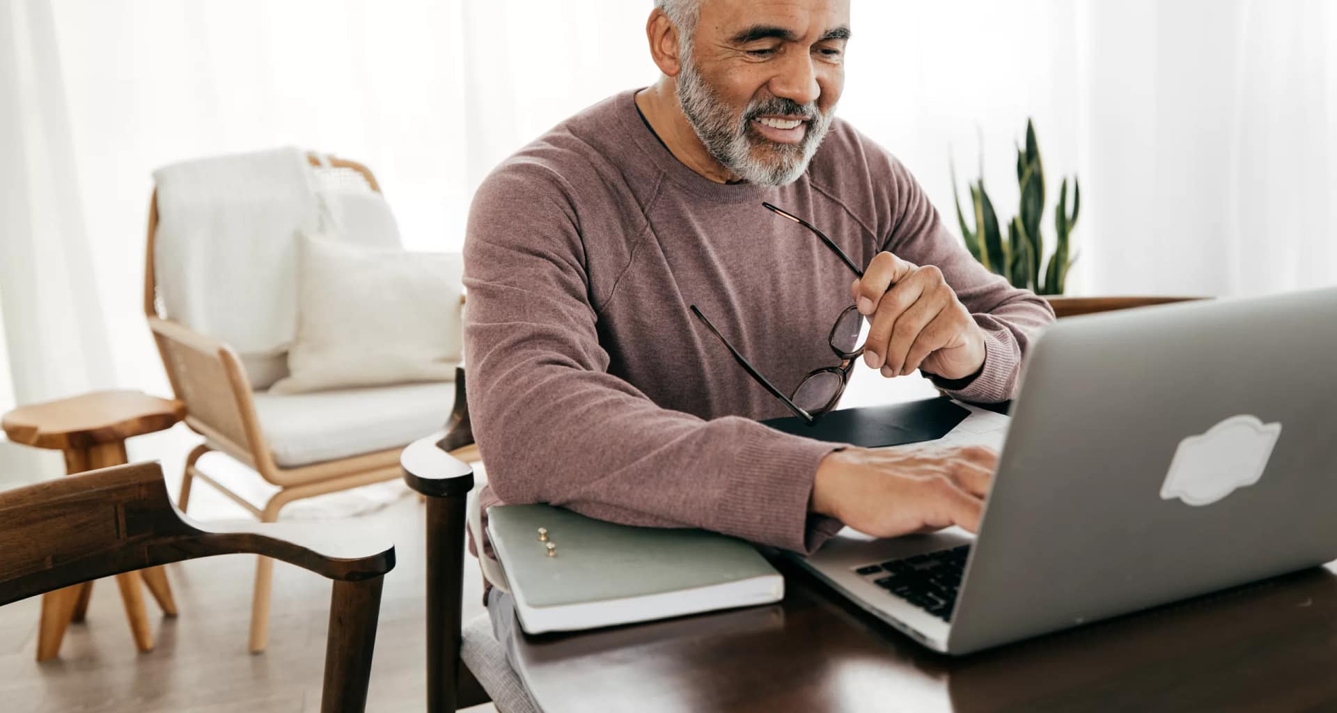 older man smiling laptop gettyimages .jpg