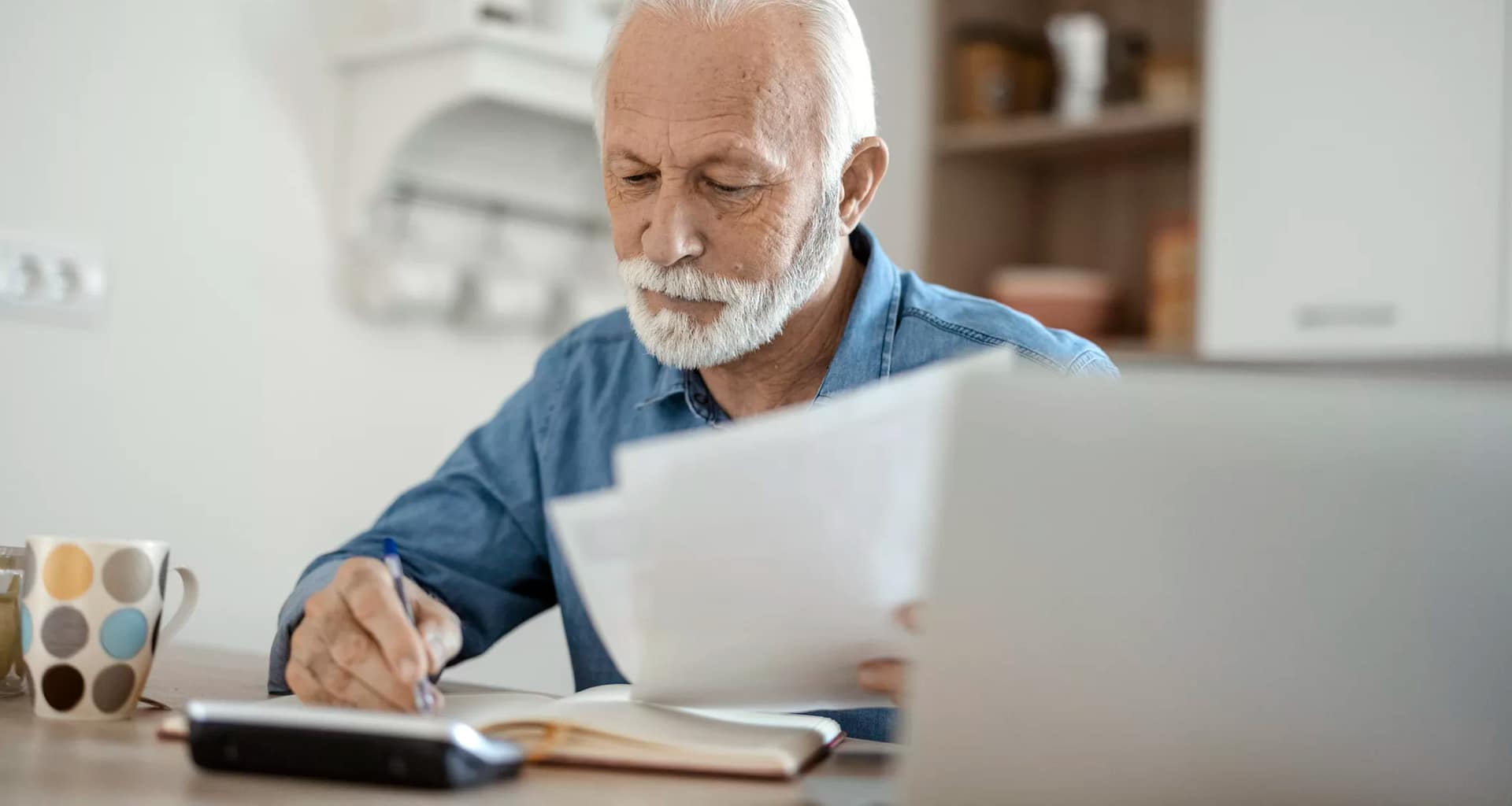 older man at desk serious gettyimages .jpg