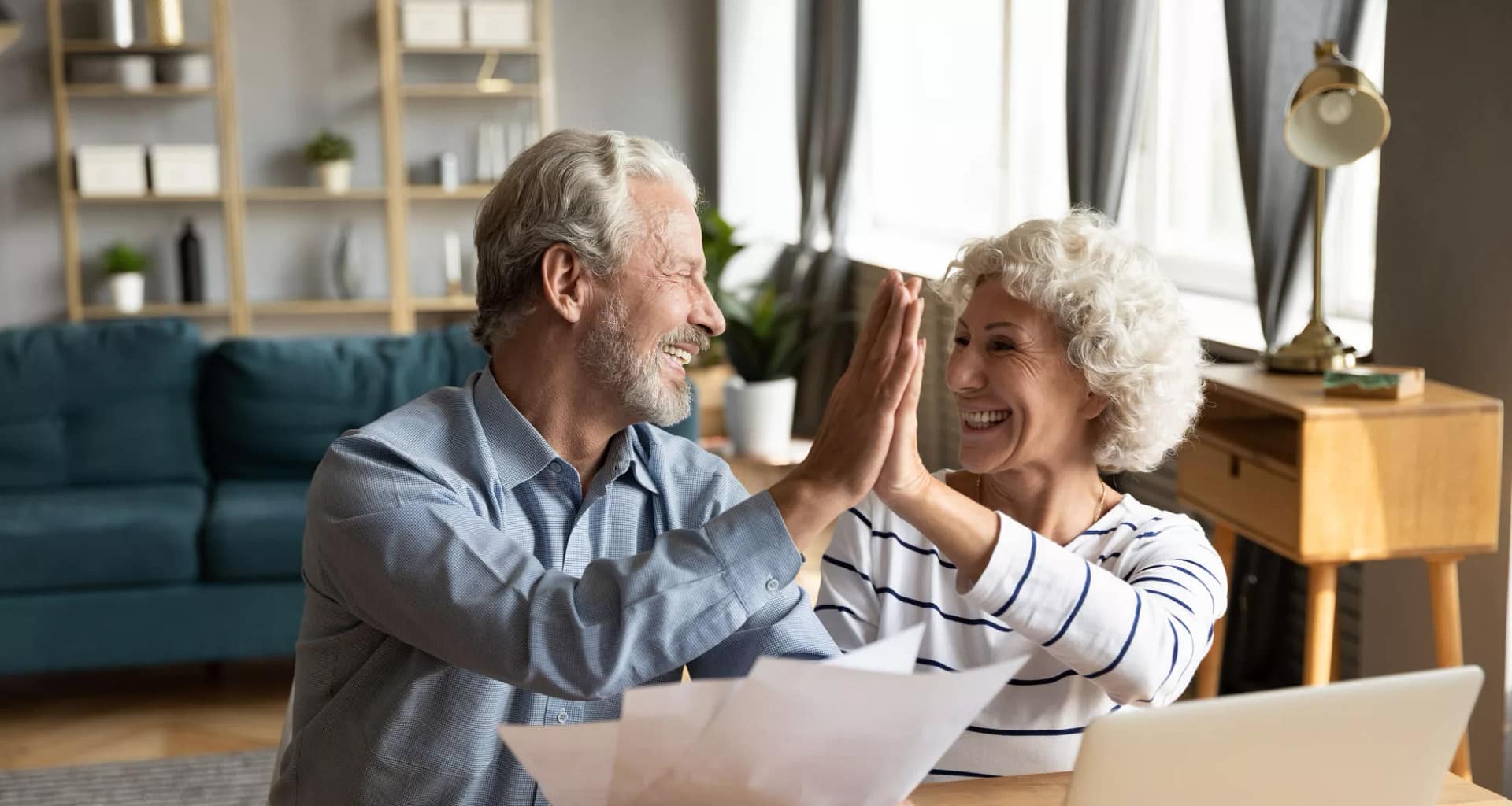 retired couple reviewing finances on a laptop.jpg